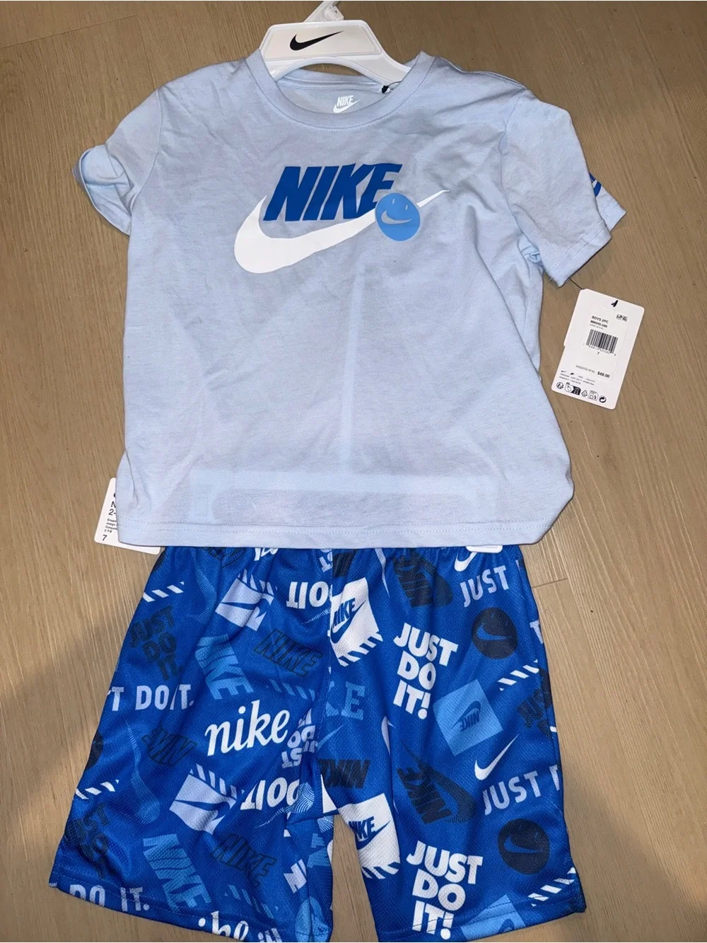 Nike Light Blue Kids Tee with White Swoosh and Wordmark